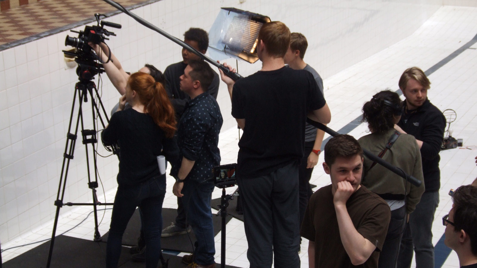 A group of people on set behind a camera at MAC Summer School