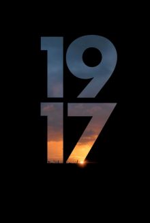 1917 in bold font revealing a sunset - the rest of the post is black