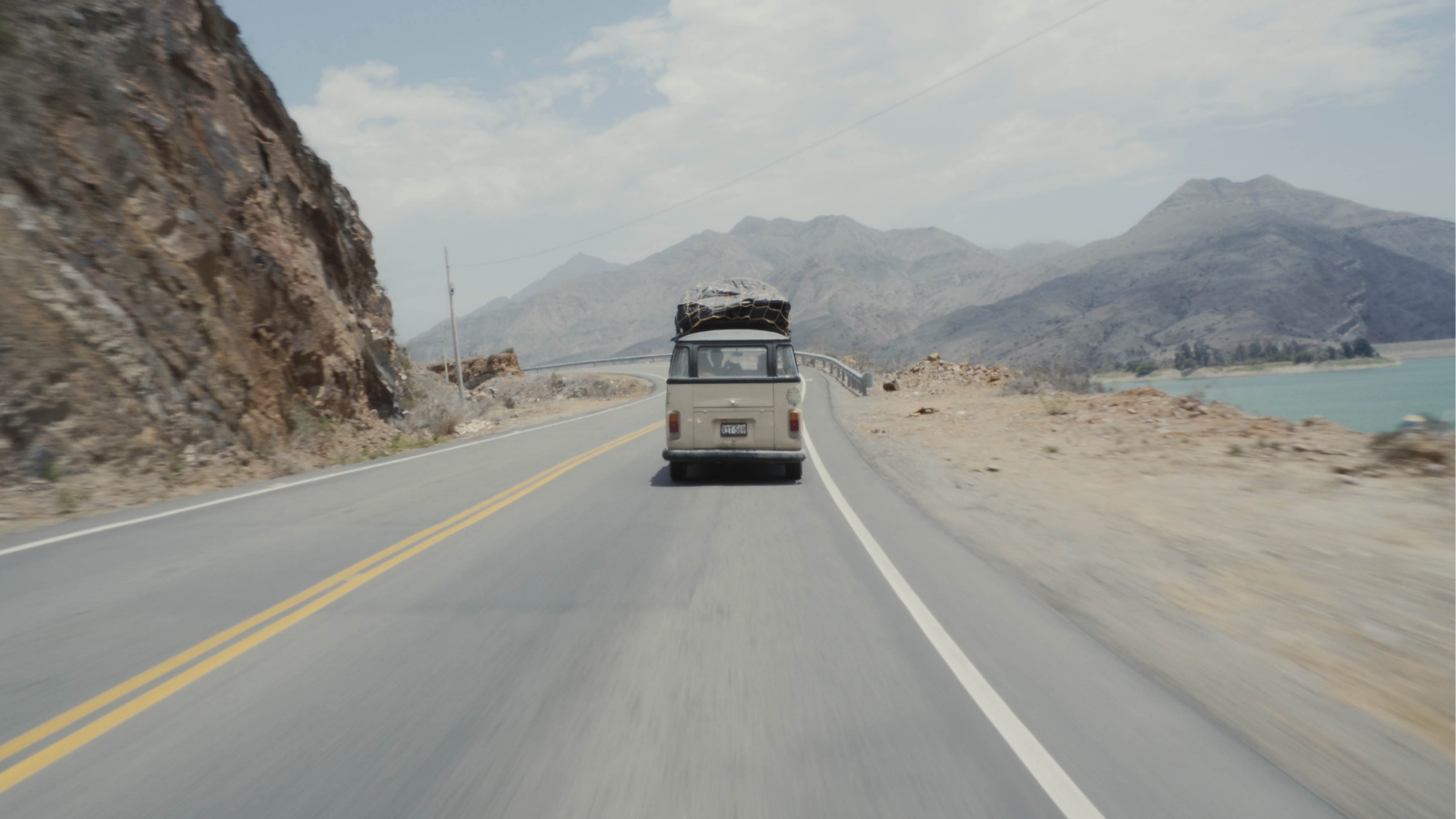 Campervan travelling along dusty road