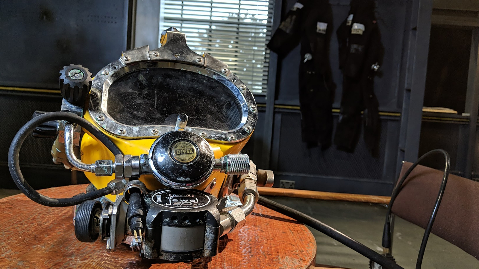 A diver climbs through an underwater vessel