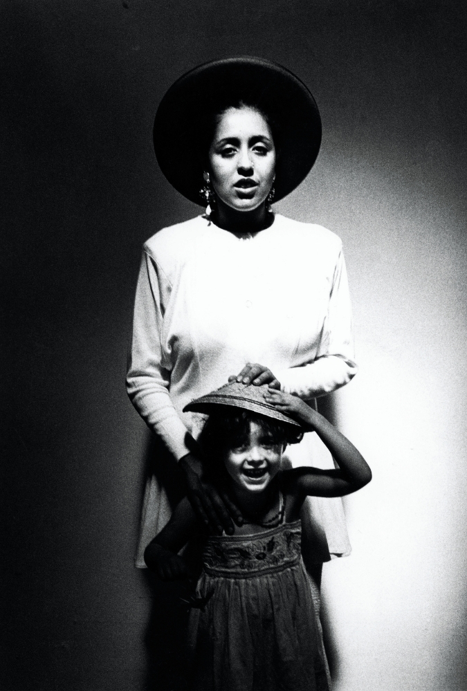 Poly Styrene stands with Celeste in a black and white image
