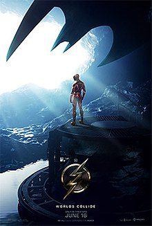 The Flash 2023 movie poster. Barry Allen / The Flash stands on cliff edge underneath large bat wing.