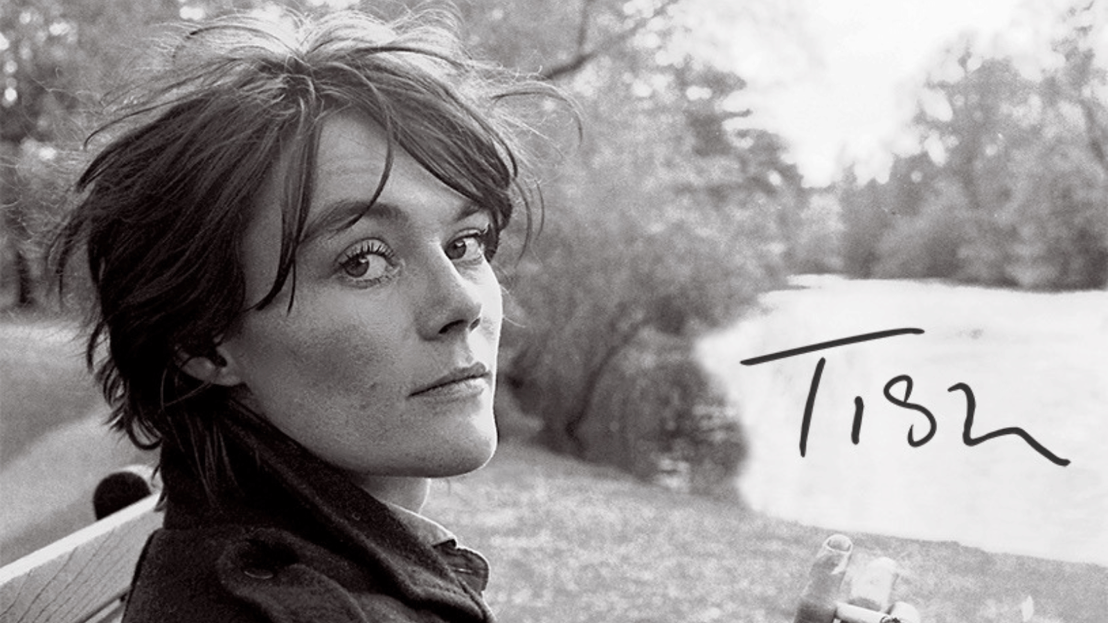 Tish primary promotional image.Black and white photograph of Tish Murtha looking at the camera.