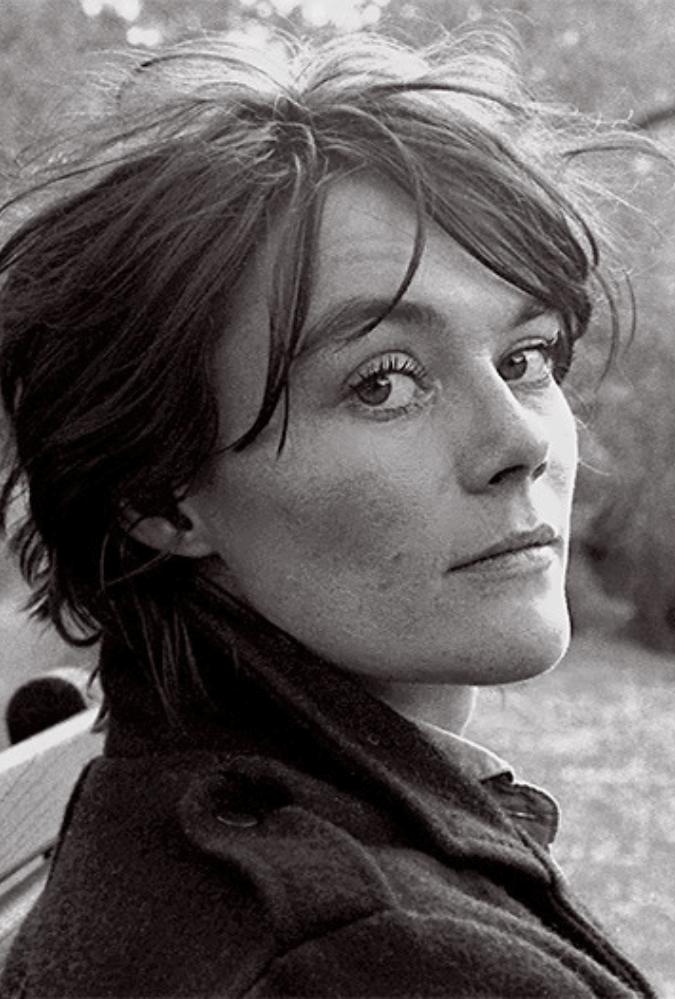 Tish primary promotional image.Black and white photograph of Tish Murtha looking at the camera.