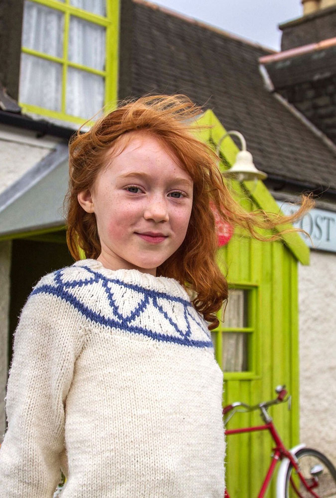 Photo from Katie Morag, showing a young girl with red hair smiling at the camera