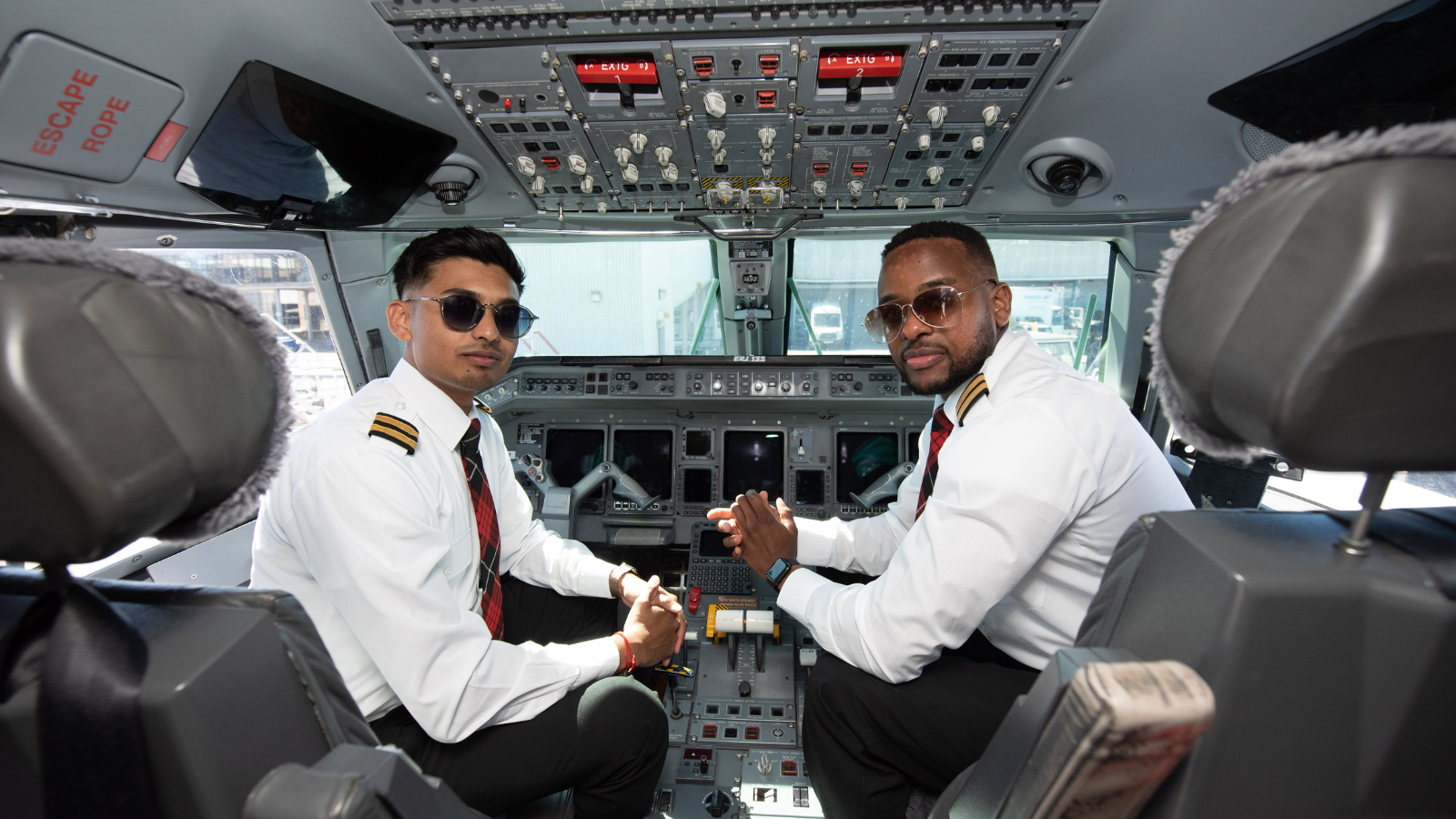 Two young pilots in the cock pit