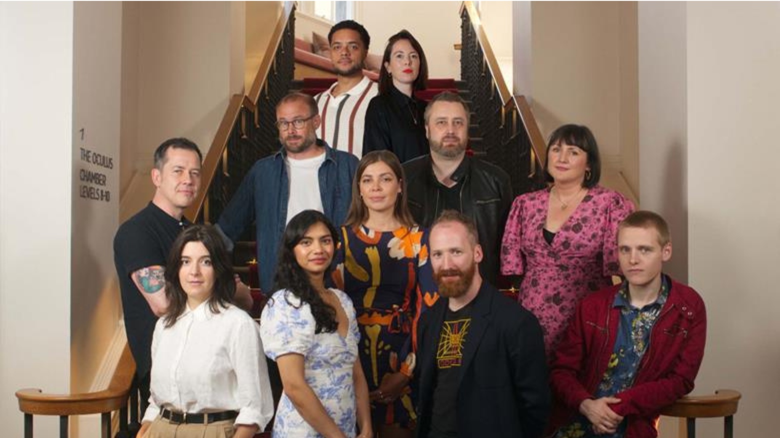 The Rising Stars Scotland cohort from 2022, standing in four rows on a set of stairs