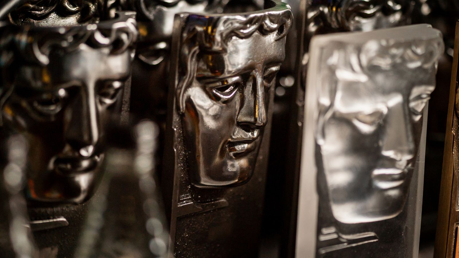 Black and white image showing a close up of BAFTA awards