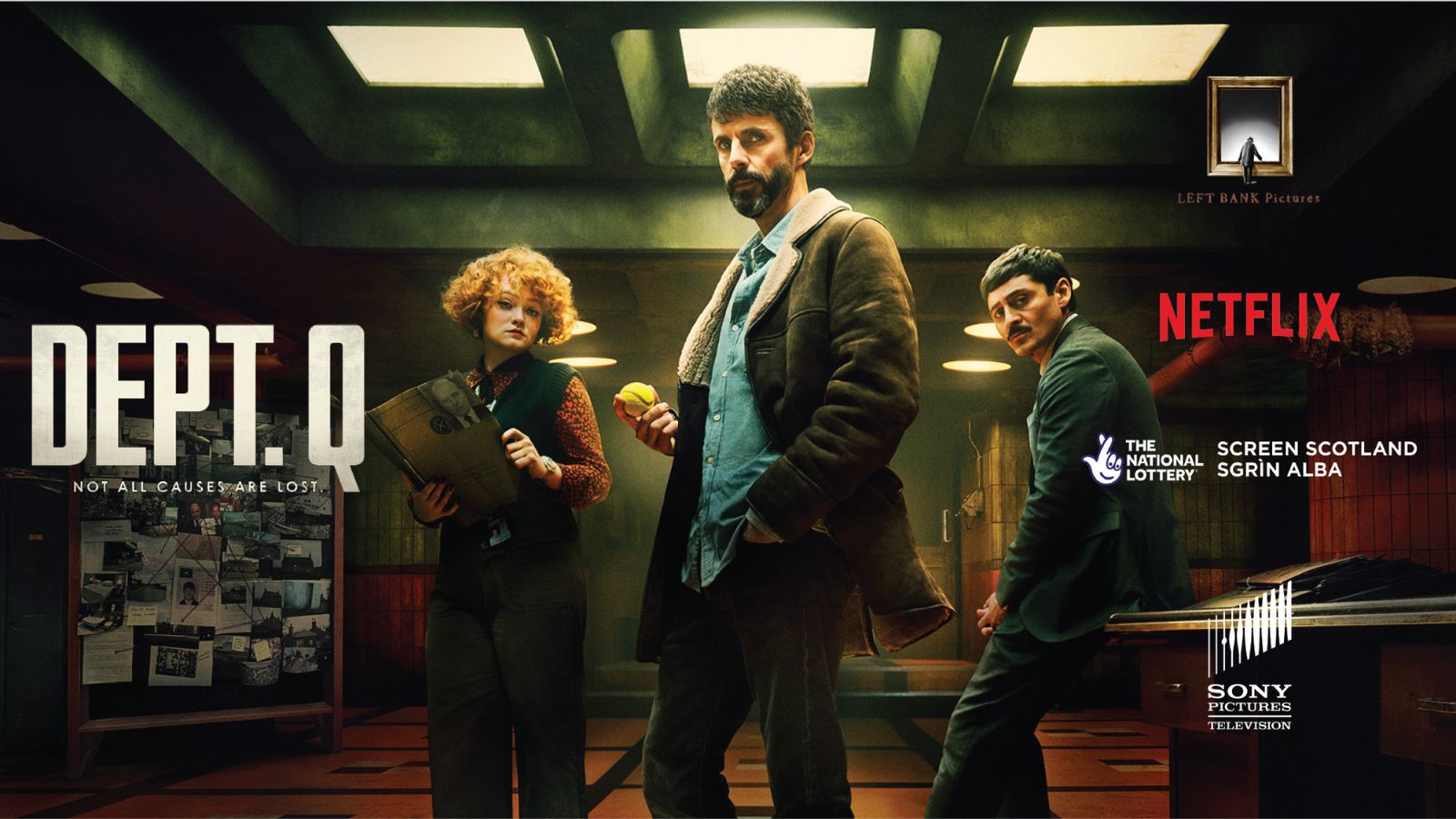 The image shows a promotional poster for "Dept. Q" on Netflix, featuring three people. A woman with curly red hair holds a folder, a man with a beard is holding a yellow ball, and another man stands behind them. A bulletin board with pinned notes is visible in the background. Text includes the Netflix logo and production credits.