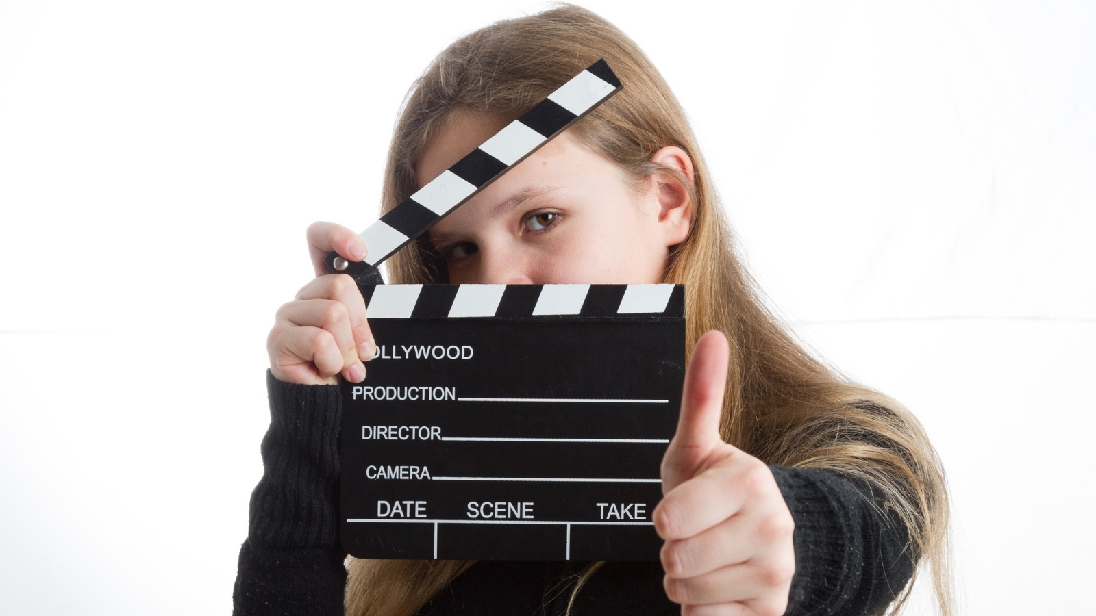 A person holding a film clapperboard