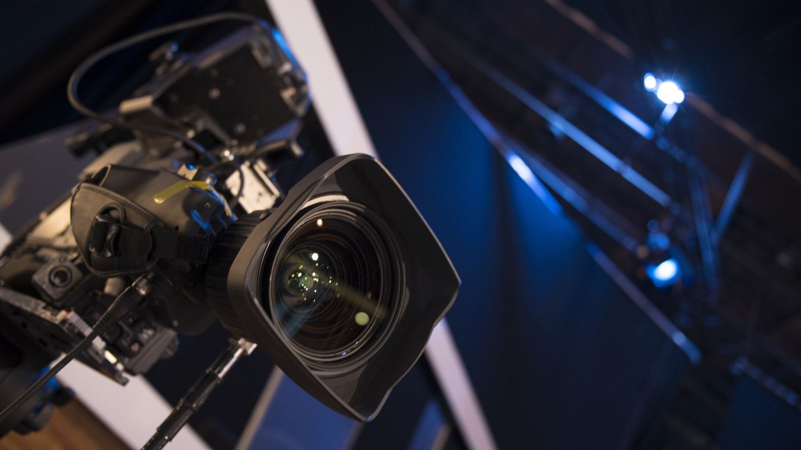 Close up image of a film camera on a TV set